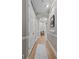 Bright hallway with hardwood floors, a small bench, and elegant wall trim at 45 N Ogden St # 201, Denver, CO 80218