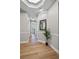 Hallway with light hardwood floors, clean lines, and recessed lighting at 45 N Ogden St # 201, Denver, CO 80218
