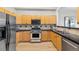 Well-maintained kitchen features stainless steel appliances and light wood cabinets at 45 N Ogden St # 201, Denver, CO 80218