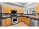 Efficient kitchen features stainless steel appliances, light wood cabinets, and a convenient layout at 45 N Ogden St # 201, Denver, CO 80218