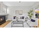 Cozy living room with fireplace and light wood flooring at 45 N Ogden St # 201, Denver, CO 80218