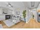 Bright living room with fireplace, plush seating, and hardwood floors at 45 N Ogden St # 201, Denver, CO 80218
