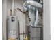 A view of the home's utility room with water heater and furnace at 45 N Ogden St # 201, Denver, CO 80218