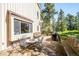 Outdoor dining and seating area on spacious deck with barbecue, offering scenic views at 24999 Grandview Ave, Golden, CO 80401