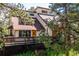 Charming home with spacious deck surrounded by mature trees and natural landscaping at 24999 Grandview Ave, Golden, CO 80401