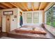 Hot tub room featuring tiled flooring, wood ceiling, and large windows with scenic views for relaxation at 24999 Grandview Ave, Golden, CO 80401