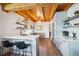 Modern kitchen featuring quartz countertops, stainless steel appliances, and island seating at 24999 Grandview Ave, Golden, CO 80401