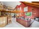 Inviting living room featuring vaulted ceilings, a loft area, and natural light at 24999 Grandview Ave, Golden, CO 80401
