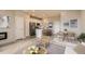 Open-concept living space with modern kitchen, dining area, and cozy living room at 6847 Huddersfield Ln, Castle Pines, CO 80108