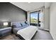 Relaxing bedroom features a large window with nice view and modern design at 6619 E Lowry Blvd # 112, Denver, CO 80230