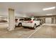 Clean and organized multi-car garage providing secure parking with ample space and lighting at 6619 E Lowry Blvd # 112, Denver, CO 80230