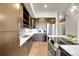 Modern kitchen featuring stainless steel appliances, white countertops, and modern pendant lighting at 6619 E Lowry Blvd # 112, Denver, CO 80230