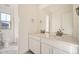 Modern bathroom with double sinks, vanity, and a separate toilet area at 2956 S Quaker St, Morrison, CO 80465