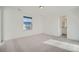 Comfortable bedroom with neutral walls, carpet, and a large window at 2956 S Quaker St, Morrison, CO 80465