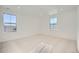Bright bedroom with plush carpet, recessed lighting, and windows offering natural light at 2956 S Quaker St, Morrison, CO 80465