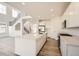 Open-concept kitchen features a large island, stainless steel appliances, and hardwood floors at 2956 S Quaker St, Morrison, CO 80465