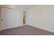 A bedroom with closet doors and an en-suite bathroom at 1530 S Quebec Way # 34, Denver, CO 80231