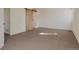 A bedroom featuring neutral carpet, fresh paint, and a barn door to a walk-in closet at 1530 S Quebec Way # 34, Denver, CO 80231