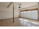 Spacious two-car garage with concrete flooring, white walls, and an automatic door opener installed at 1530 S Quebec Way # 34, Denver, CO 80231