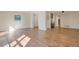 Spacious open-concept living area with hardwood floors, offering a versatile layout for modern living at 1530 S Quebec Way # 34, Denver, CO 80231