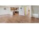 Bright, open-concept living area with hardwood floors, connecting seamlessly to the kitchen at 1530 S Quebec Way # 34, Denver, CO 80231