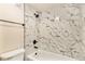 Modern bathroom with marble tile shower and tub at 3549 S Fairplay Way # 10, Aurora, CO 80014