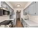 Modern kitchen with stainless steel appliances and quartz countertops at 3549 S Fairplay Way # 10, Aurora, CO 80014