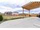 Cozy backyard patio featuring a wooden pergola, great for enjoying sunny afternoons at 5937 N Orleans St, Aurora, CO 80019