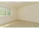 Empty bright bedroom with a window providing natural light and neutral carpet at 5937 N Orleans St, Aurora, CO 80019