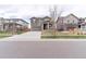 Charming two-story home with a covered porch and attached two-car garage at 5937 N Orleans St, Aurora, CO 80019