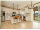 Modern kitchen with white cabinets, stainless steel appliances, and a center island at 5937 N Orleans St, Aurora, CO 80019