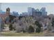 Stunning city skyline view with tree-lined park in foreground at 2225 Buchtel Blvd # 1109, Denver, CO 80210