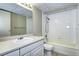 Simple bathroom, featuring a shower/tub combo and white vanity at 2225 Buchtel Blvd # 1109, Denver, CO 80210