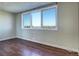 Bright bedroom with hardwood floors and expansive windows at 2225 Buchtel Blvd # 1109, Denver, CO 80210