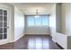 Bright dining room with hardwood floors and large windows offering an outdoor view at 2225 Buchtel Blvd # 1109, Denver, CO 80210