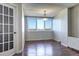 Bright dining room with hardwood floors and large windows at 2225 Buchtel Blvd # 1109, Denver, CO 80210