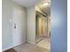 Apartment entryway with mirrored closet doors and tiled flooring at 2225 Buchtel Blvd # 1109, Denver, CO 80210