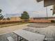 Community patio with picnic tables and an in-ground pool at 2225 Buchtel Blvd # 1109, Denver, CO 80210