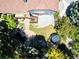Aerial view of the backyard with a lush garden, a koi pond, a deck and a trampoline at 3253 S King Way, Denver, CO 80236