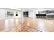 View of the finished basement with a wet bar, built-ins, and an outdoor access door at 3253 S King Way, Denver, CO 80236