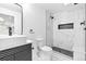 Modern bathroom featuring black and white marble shower, vessel sink, and black fixtures at 3253 S King Way, Denver, CO 80236