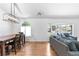 Dining room with a large window and hardwood floors at 3253 S King Way, Denver, CO 80236