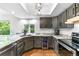Modern kitchen with marble countertops, custom cabinets, and sleek appliances at 3253 S King Way, Denver, CO 80236