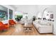 Open-concept living room with hardwood floors and bright natural light at 3253 S King Way, Denver, CO 80236