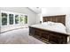 A spacious main bedroom featuring a large window and a king size bed at 3253 S King Way, Denver, CO 80236