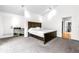 A relaxing main bedroom featuring a king size bed, carpet, and neutral paint at 3253 S King Way, Denver, CO 80236