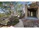 Backyard view featuring a stone walkway, well-manicured landscaping, and a glimpse of the patio area at 8198 S Sicily Ct, Aurora, CO 80016