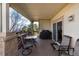 Outdoor covered deck featuring ample seating, a grill, and scenic views, great for gatherings and relaxation at 8198 S Sicily Ct, Aurora, CO 80016