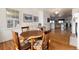 Eat-in kitchen space with hardwood floors and natural light streaming in from the window at 8198 S Sicily Ct, Aurora, CO 80016