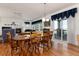 A dining room with wood furniture, a ceiling fan, and sliding doors to the patio at 8198 S Sicily Ct, Aurora, CO 80016